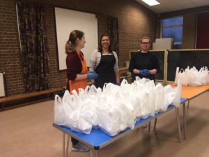 Volunteers hand out food packages at Muswell Hill Baptist Church soup kitchen