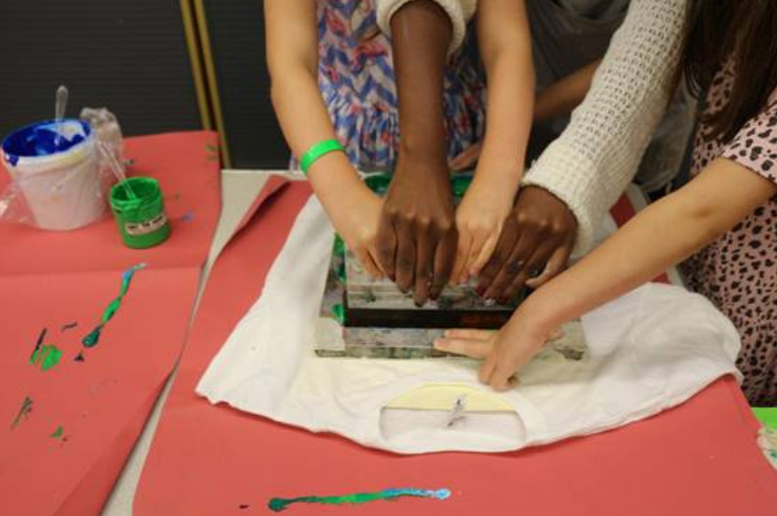 Wax printing workshop with box of prints
